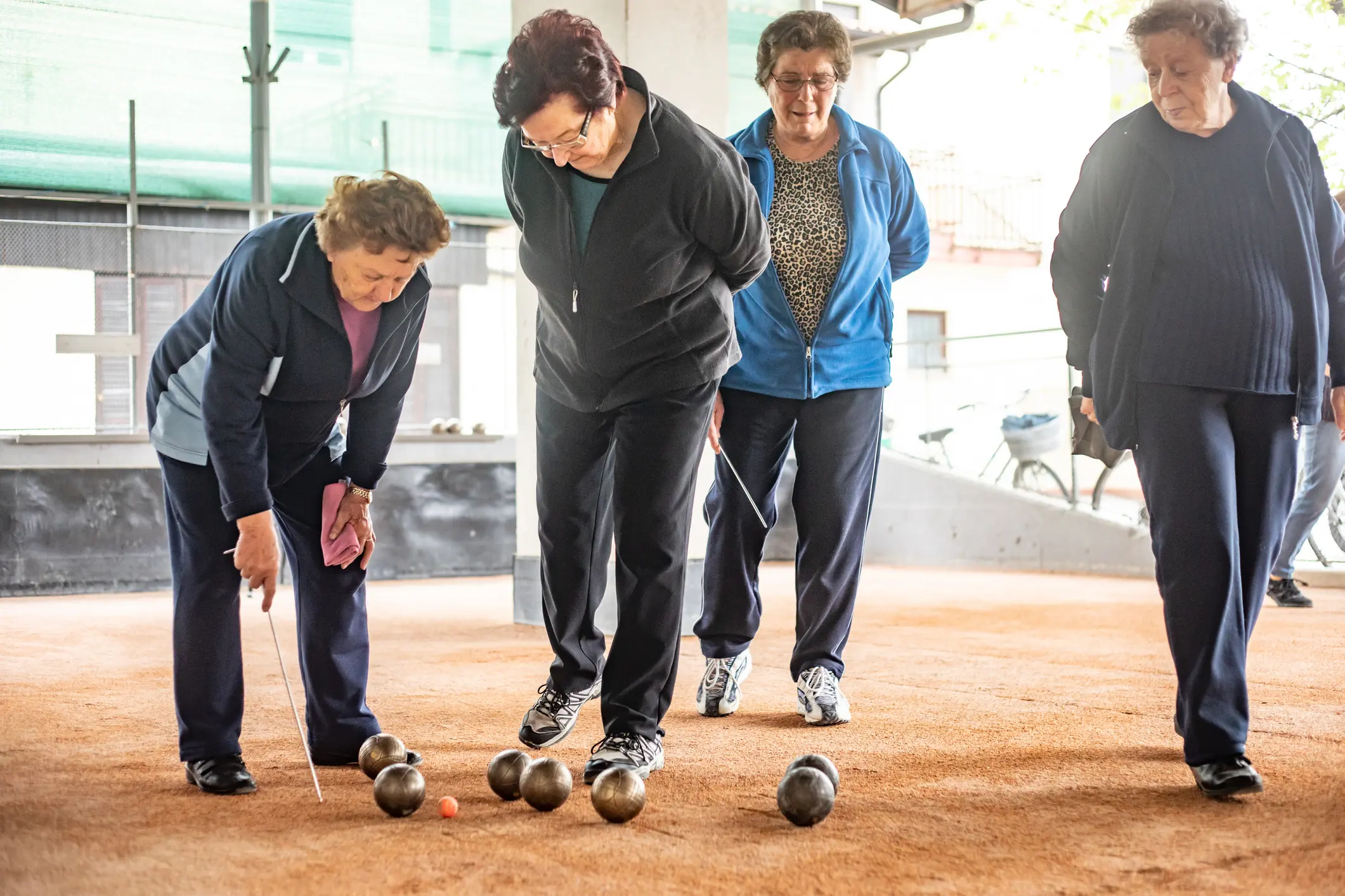 Senior Woman Marking Where Bocce Ball Has Stopped