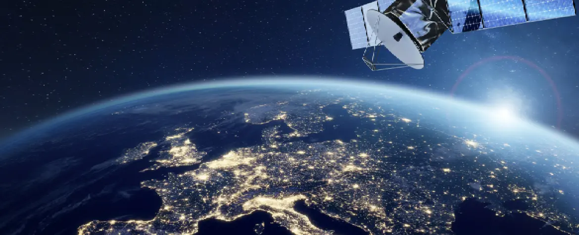 A satellite orbits over Europe at night. You can see the lights of the countries.